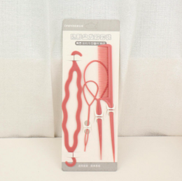 Pink hair styling tool set for creating various hairstyles. Includes tools for curling, waving, and shaping hair. Suitable for short to medium length hair.