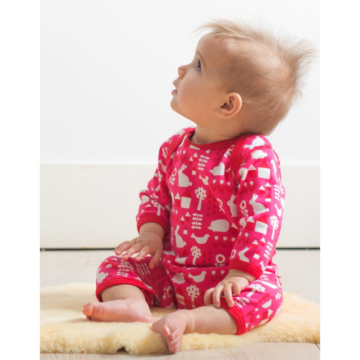 Organic cotton baby pajamas with a garden print