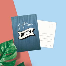 Postcard with text "Greetings from the Rhine" in a stylized design featuring a blue and white striped pattern.
