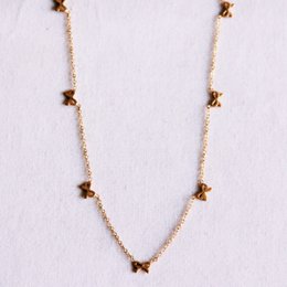 Delicate necklace with bows - gold