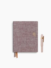 A6 notebook with rose dust cover, made of textured material.