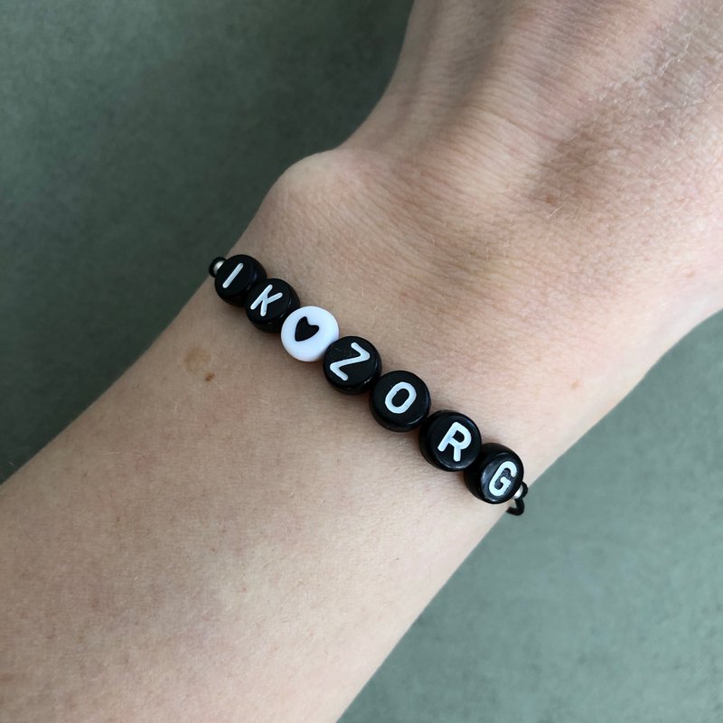 Armband I care Schwarz und Weiß mit Charme
