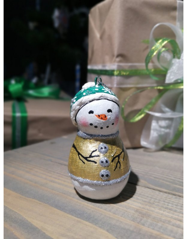 Handmade papier-mache Snowman in a green hat