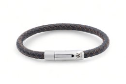 Leather bracelet in various colors and sizes, with a braided design and metal clasp closure.