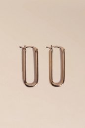  Gold hoop earrings with a simple, minimalist design.
