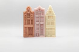 Set of 3 traditional Dutch canal house-shaped soap bars in pastel colors. Handmade, natural ingredients.