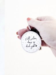  Handmade vegan leather keychain with the saying "It's great that you exist" in a round design.