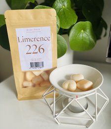 Wax melts in a chamomile and vanilla scent, packaged in a yellow bag labeled "Limerence 226".