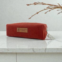  Rectangular corduroy pencil case in a warm terra cotta color with a metal zipper closure.