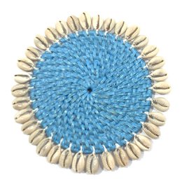 Rattan coaster with cowrie shells
