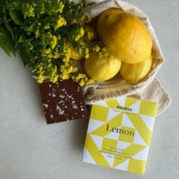 Yellow lemon chocolate bar, geometric pinwheel pattern design, 49% cocoa, citrus flavored confection