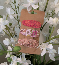 Set of 54 assorted hair clips for kids, featuring a variety of colors and designs including floral, glitter, and patterned clips.