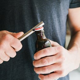 Bottle opener with leather sleeve, Brut Homeware