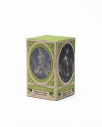 A box of REINE DES PRÈS 10 TIGES tea, featuring a floral design and green accents. The tea appears to be a loose leaf variety, packaged in a decorative box.