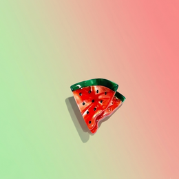  Colorful fish-shaped hair clip made of plastic, available in rose and green colors.