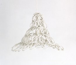 A modern, knotted pendant light fixture with a unique, sculptural design featuring an intricate, woven pattern that creates a warm, diffused glow.