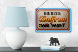 Blikskilt, der siger 18x12cm verdens bedste kone dekoration