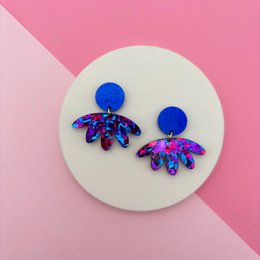 Blue magenta multicolored drop earrings with octopus-shaped pendants, vibrant iridescent finish, statement jewelry.
