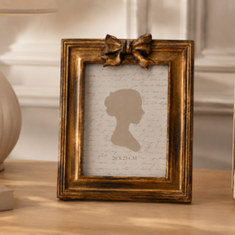 Gold bow resin photo frame 24x19 cm