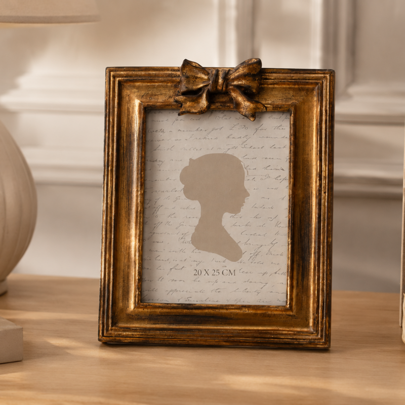 Gold bow resin photo frame 24x19 cm