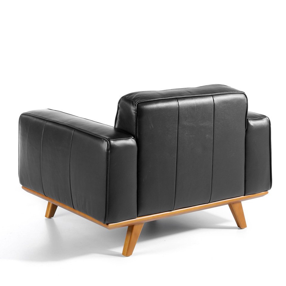 Armchair upholstered in leather and Walnut wood legs