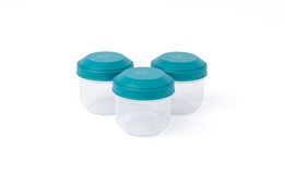 A set of 3 colorful snack boxes in oat, poppy, and lagoon colors. The boxes have a clear lid to display the contents, which appear to be a variety of healthy snacks.