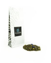 Premixed tea bag containing a blend of green tea leaves, chamomile flowers, and blue cornflower petals for a calming and relaxing tea experience.