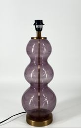 This lamp base features a unique, stacked glass design in a vibrant purple color. The rounded, hourglass shape creates an eye-catching and modern look that would complement a variety of decor styles. The lamp base is made of high-quality materials and includes a sturdy metal base.