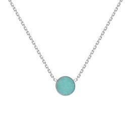Delicate silver necklace with a round turquoise-colored stone pendant. The necklace features a simple, minimalist design that would complement a variety of outfits.