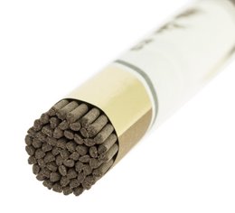 Incense sticks made from special Agarwood, with a natural, earthy scent. The incense sticks have a cylindrical shape and are packaged in a white tube with Japanese text.