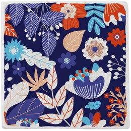 A round, dark gray marble coaster with a floral pattern in shades of blue, orange, and white. The coaster has a decorative design featuring leaves, flowers, and abstract shapes.