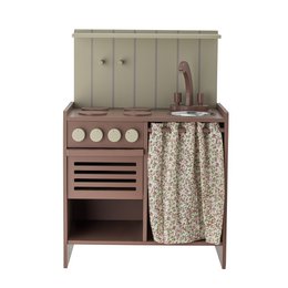 A miniature wooden play stove in a neutral brown color, with a curtain and storage space, suitable for children's play kitchens or pretend play.
