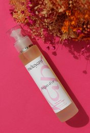 Dry body oil with argan oil, 100 ml bottle, moisturizing formula, natural ingredients, suitable for all skin types.