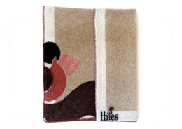 Beige wool blanket with red and black squirrel design, eco-friendly throw.
