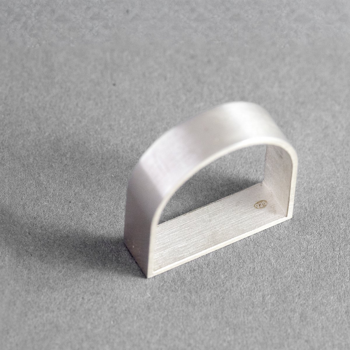 ARK Silver is a sculptural ring inspired by architecture and geometric form.