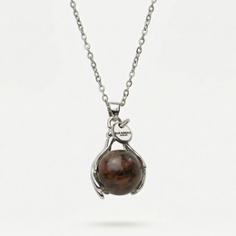  Mahogany obsidian pendant necklace with silver chain. Pendant features a round, dark brown stone with natural patterns.