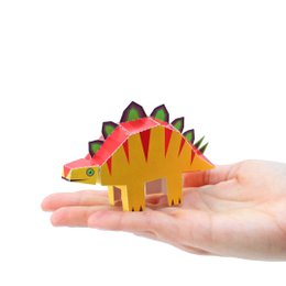  Colorful stegosaurus dinosaur postcard with vibrant orange, yellow, and green tones. Features a playful, cartoon-like design suitable for thank you cards or correspondence.