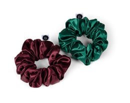 Luxury silk scrunchies in forest green and burgundy red colors. Soft, stretchy, and durable hair accessories.