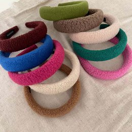 Colorful, soft, and stylish hairbands in various shades including camel, dark green, green, fuchsia, and navy.