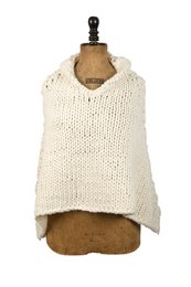 Off-white knitted poncho, sleeveless, cozy textured fabric, loose oversized fit, casual style.