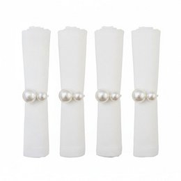 A set of 4 pearl-embellished napkin rings made of a neutral-colored fabric material, suitable for formal or elegant table settings.