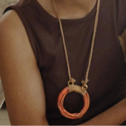 Orange papier-mâché circular pendant, ring of fire design, long chain necklace, handmade artisan jewelry