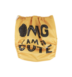 Washable diaper bag with "OMG I am cute" text and polka dot pattern.