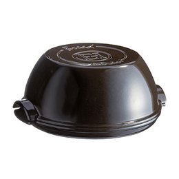 A round, black ceramic bread baking tin from Emile Henry, available in black or red. The tin measures 295mm in diameter and is suitable for baking bread, cakes, and other baked goods.