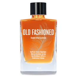 Old fashioned whiskey cocktail with amber-colored liquid and ice cubes in a glass tumbler.