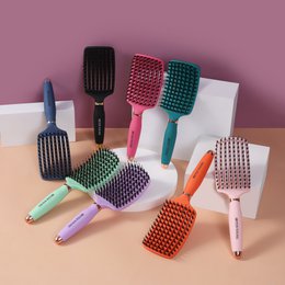  Colorful paddle hairbrush with boar bristles, available in multiple vibrant colors including black, pink, mint, and blue.