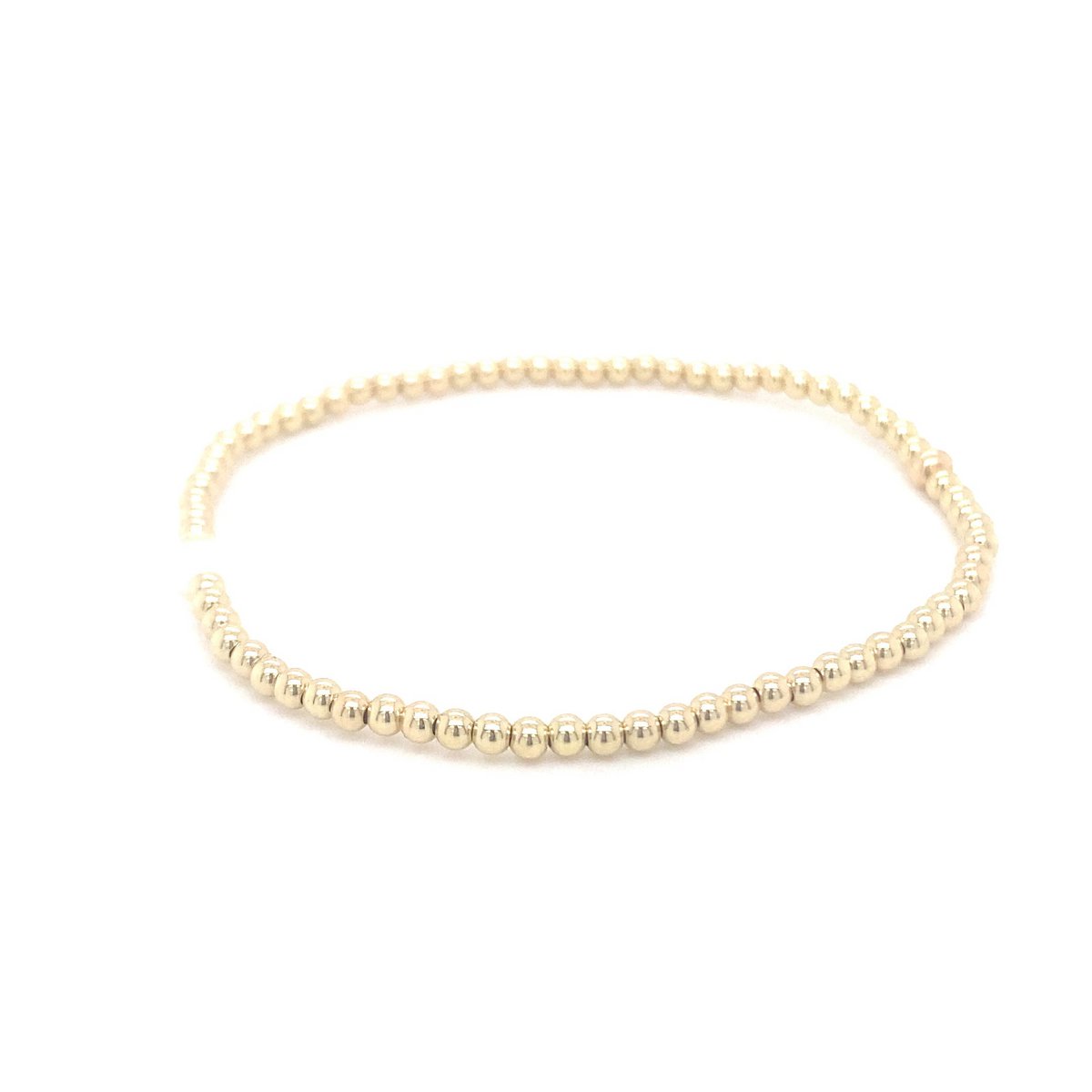 Gold ball bracelet with single pearl