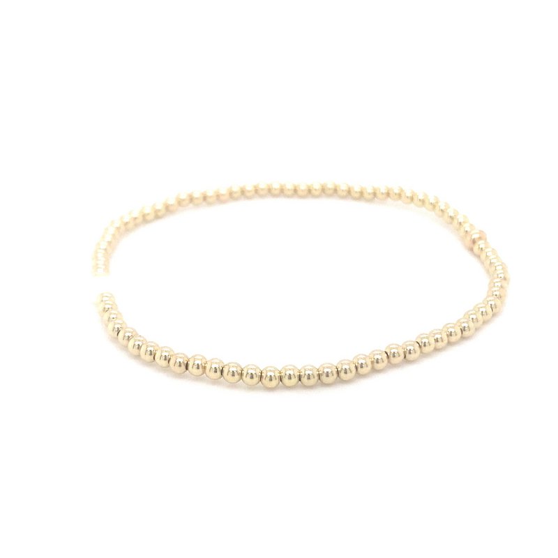 Gold ball bracelet with single pearl