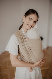 Beige minimalist woven wrap for babywearing, available in sizes M (4.2m), L (4.6m), and S (3.6m). Made of natural, eco-friendly materials.