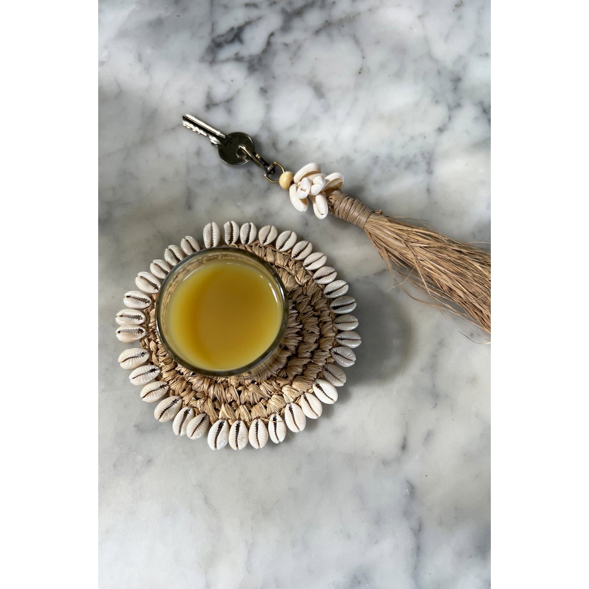 The Raffia Cowrie Shell Keychain